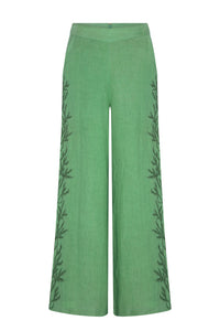 Mint green linen-blend palazzo pants featuring a high-rise waistband and flowing wide-leg silhouette. Delicate tonal botanical embroidery runs along the outer sides of each leg, adding subtle texture and an elegant nature-inspired detail.