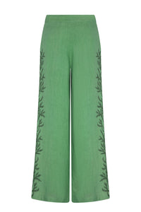 Back view of mint green wide-leg palazzo pants with a clean, tailored waistband and relaxed drape. Tonal botanical embroidery extends along the side seams, creating a refined and coordinated finish.