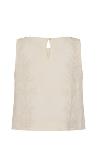 Back view of the sleeveless gardenia-white top featuring tonal botanical embroidery along both sides and a keyhole button closure at the neckline. The relaxed silhouette and lightweight fabric offer effortless sophistication and comfort.