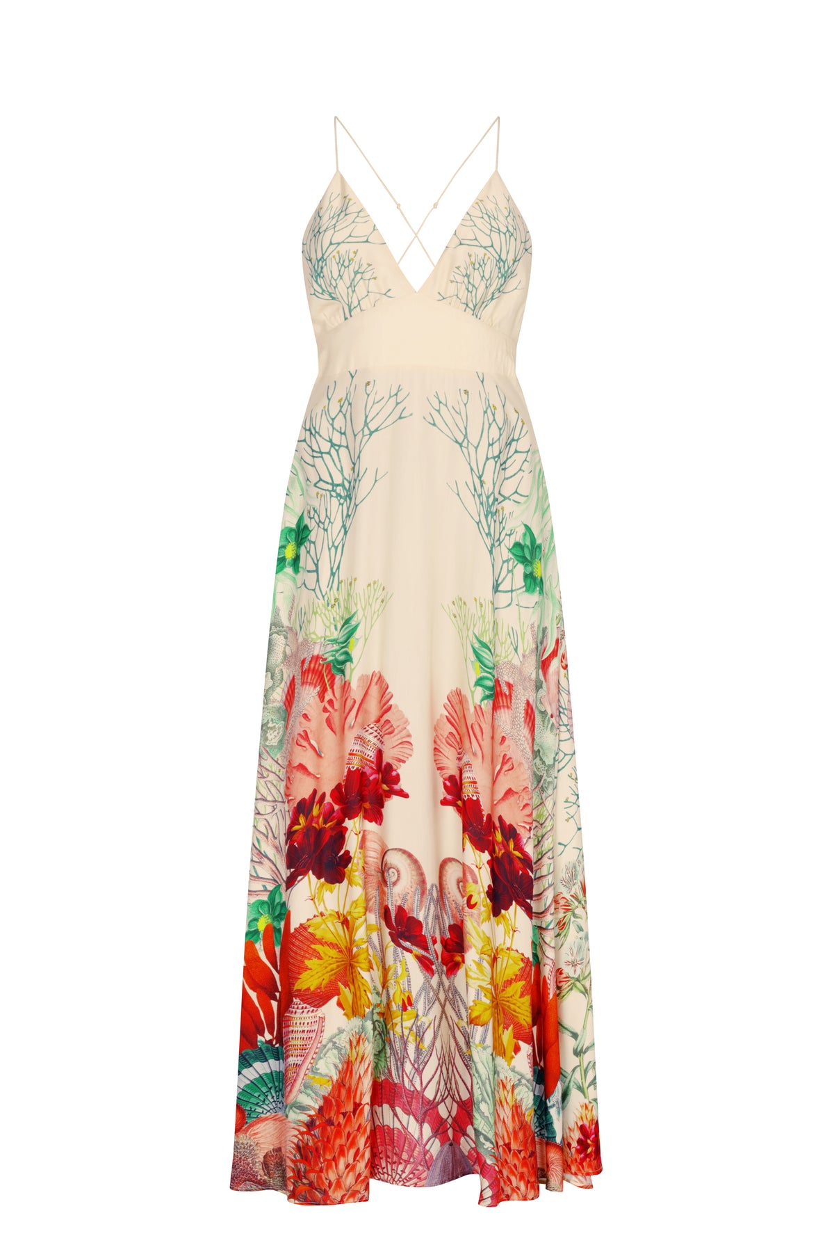 Cream maxi dress featuring a plunging V-neckline, delicate crisscross spaghetti straps, and a fitted empire waist with a decorative drawstring detail. The flowing skirt showcases a vibrant sea-inspired print with coral branches, shells, tropical florals, and marine motifs in shades of red, orange, green, teal, and pink.
