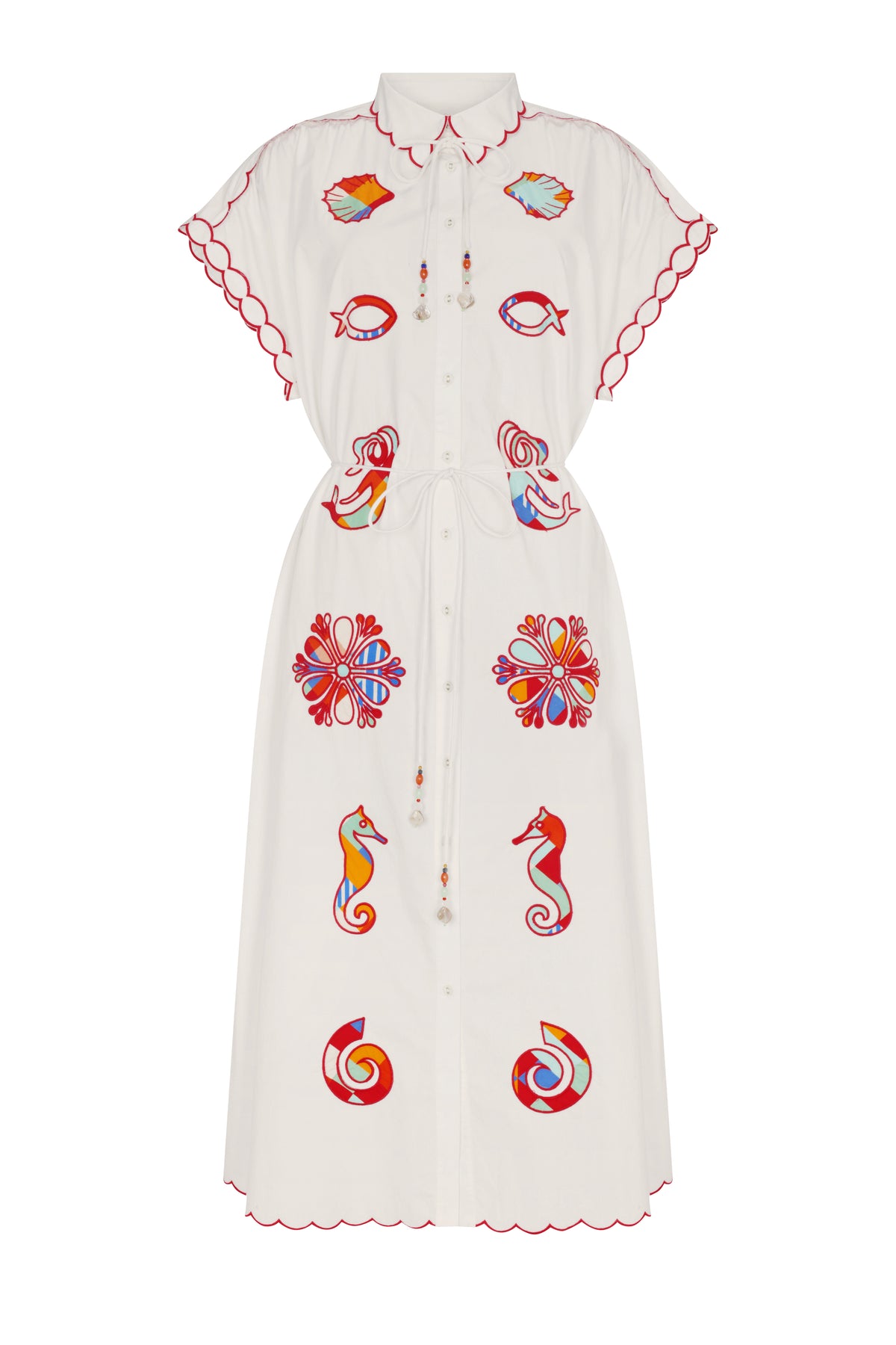 Off-white midi shirt dress featuring a classic collar, button-front closure, flutter sleeves, and an adjustable drawstring waist accented with beaded tassels. Colorful marine-inspired appliqué motifs, including seashells, fish, seahorses, and floral medallions, add a playful coastal touch.