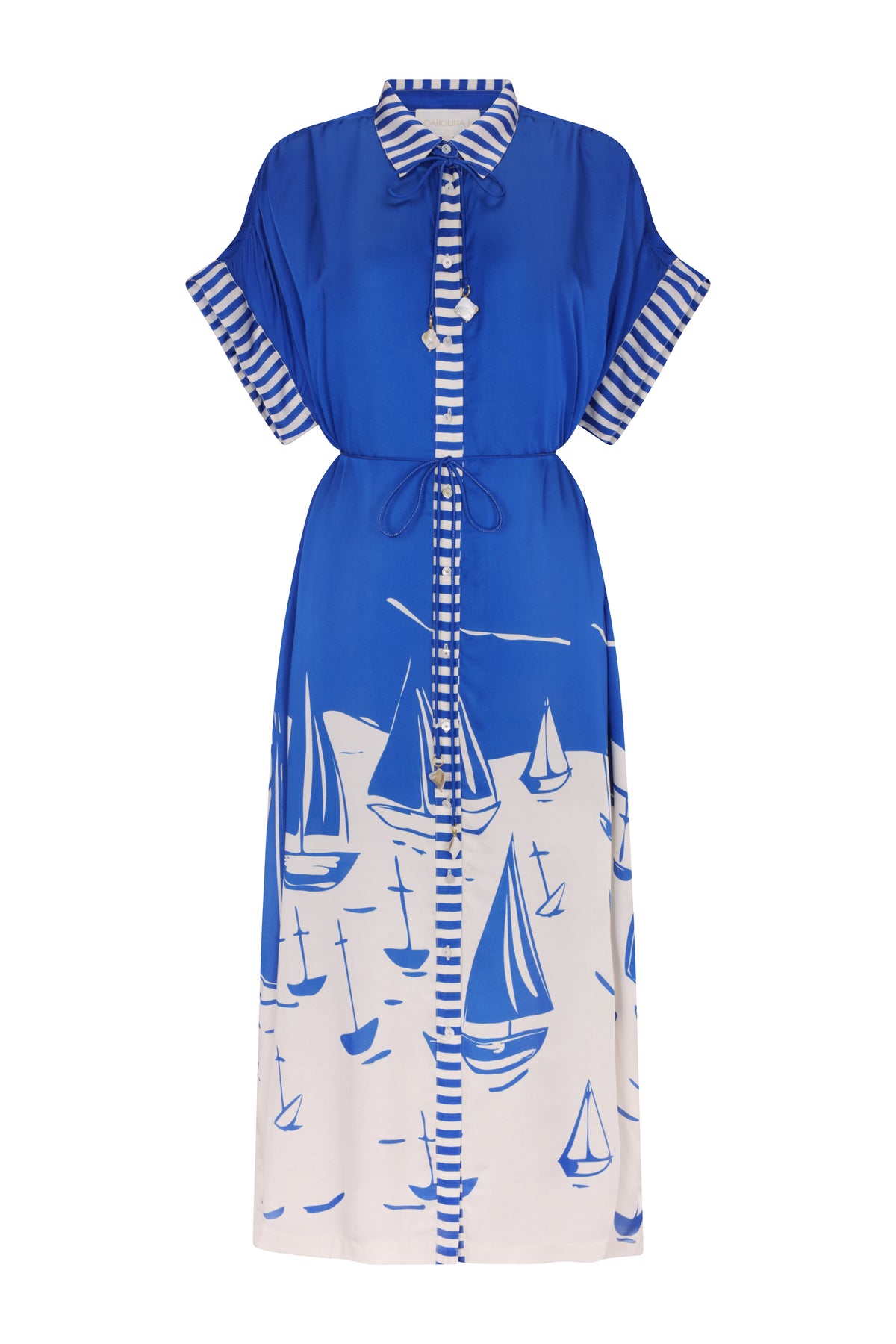 Royal blue midi kaftan dress featuring a collared neckline, button-front closure, striped placket and sleeve cuffs, and a self-tie drawstring waist. The skirt showcases a striking white sailboat print, creating a nautical-inspired look with a relaxed, effortless fit.
