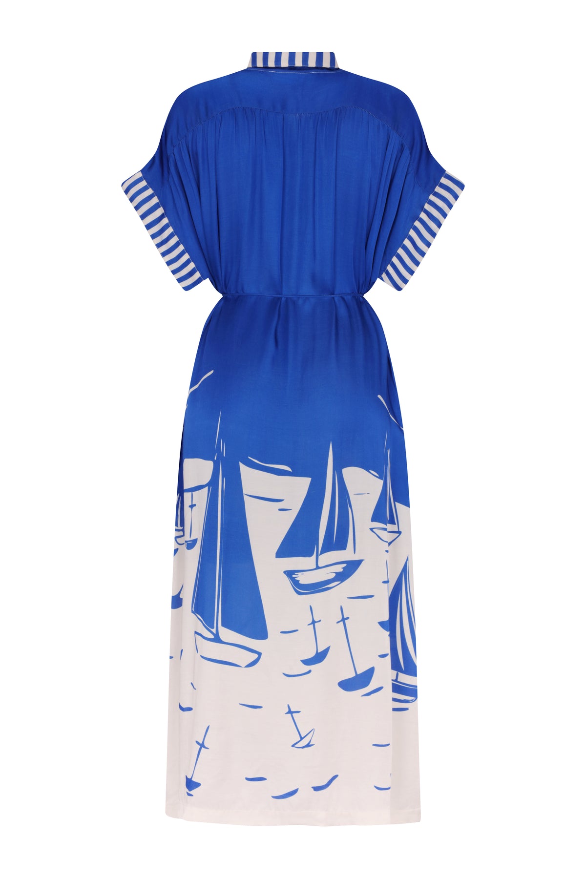 Royal blue midi kaftan dress with a relaxed silhouette, short wide sleeves, and an adjustable drawstring waist. The back features striped trim on the collar and sleeve cuffs, while the lower skirt is adorned with a bold white sailboat print inspired by a coastal marina scene.